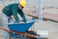 Worker Cleaning Wheel Barrow Royalty Free Stock Photo