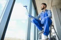 worker cleaning windows service on high rise building Royalty Free Stock Photo