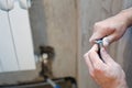 A worker cleans the pipe preparing it for Royalty Free Stock Photo