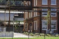 A worker cleans windows at The Mill urban apartments