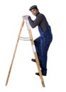 Worker climbing step ladder Royalty Free Stock Photo