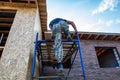 Worker climbs onto the roof Royalty Free Stock Photo