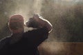 Worker in Cloud of Sawdust Royalty Free Stock Photo