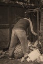 A worker collects the plastic rubbish to a basket for recycling