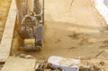 worker compresses sand in blind area around building with special working tool & x28;tamping machine or vibratory plate Royalty Free Stock Photo