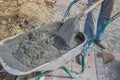 Worker with concrete mortar in wheelbarrow 2