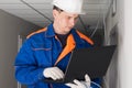 A worker configures the security of the network in the building