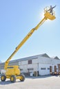 Worker on construction crane yellow