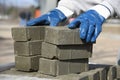 A worker puts paving slabs on a pallet.The builder takes the bricks. Royalty Free Stock Photo