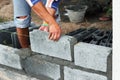 Worker construction laying concrete blocks