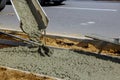 Worker construction pouring concrete cement for sidewalk Royalty Free Stock Photo