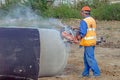 Worker at the construction site cuts the ring