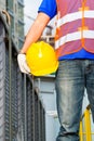 Worker on construction site with helmet or hard hat Royalty Free Stock Photo
