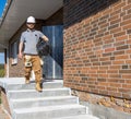 A worker at a construction site holds an electrical cable Royalty Free Stock Photo