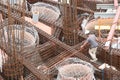 Worker in the construction site near the armatures