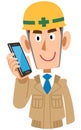 Worker on the construction site to talk on mobile phone, beige work clothes Royalty Free Stock Photo