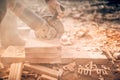 Worker on construction site, working in debris and dus, sawing and chopping bricks with angle grinder Royalty Free Stock Photo