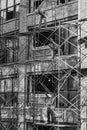 Worker at a construction site are working on a scaffold at an old typical new york brick building