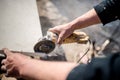 Worker at construction using grinder for cutting slate Royalty Free Stock Photo