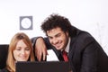 Worker couple uses laptop Royalty Free Stock Photo