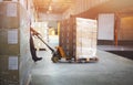 Worker Courier Unloading Package Box Out Of Cargo Container. Delivery service. Truck Loading at Dock Warehouse. Supply Chain Royalty Free Stock Photo