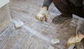 A worker creates a form for pouring concrete