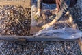 A worker creates a form for pouring concrete