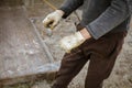 A worker creates a form for pouring concrete