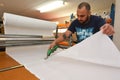 Worker cut new fabric sheet for the new National flag of New Zealand