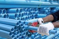 Worker cut pvc pipe