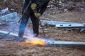A worker cut steel beams using propane-oxygen torch..Oxy-fuel cutting Royalty Free Stock Photo