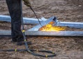 A worker cut steel beams using propane-oxygen torch Royalty Free Stock Photo