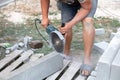 A worker cuts concrete slabs. Royalty Free Stock Photo