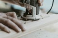 worker cuts the door hinge, milling cutter