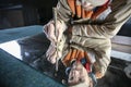 A worker cuts glass with a glass cutter Royalty Free Stock Photo