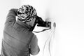 Worker cuts a hole in the wall. Installing new outlets. Work with an electric tool or angle drive grinder. dangerous job. Royalty Free Stock Photo