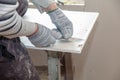 Worker cuts with a knife drywall repair Royalty Free Stock Photo