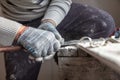 Worker cuts with a knife drywall repair Royalty Free Stock Photo