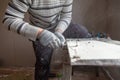 Worker cuts with a knife drywall repair Royalty Free Stock Photo