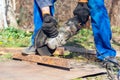 Worker cuts metal with an angle grinder Royalty Free Stock Photo