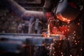 Worker cuts metal grinder. Sparks fly Royalty Free Stock Photo