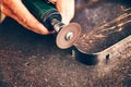 Worker cuts metal with metal sawing