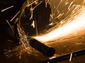 Worker cuts a metal pipe Royalty Free Stock Photo