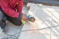 worker cuts a metal pipe with some electric device Royalty Free Stock Photo