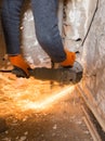 Worker cuts a metal pipe with sparks Royalty Free Stock Photo