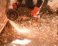 Worker cuts a metal pipe with sparks Royalty Free Stock Photo