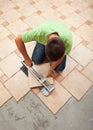 Worker cutting ceramic floor tile