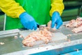 Worker cutting chicken meat from order request Royalty Free Stock Photo