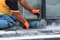 worker cutting concrete ceramic tile processing with angle grinder Royalty Free Stock Photo