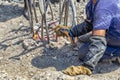 Worker cutting concrete reinforcing metal rods with torch Royalty Free Stock Photo